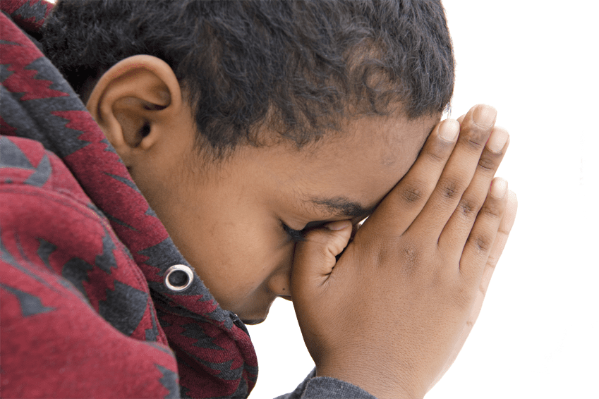 Young person in deep prayer