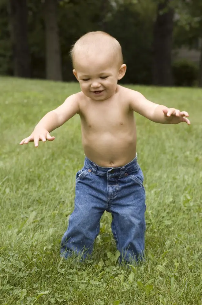 Child exploring in blue jeans